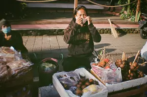 a thrasher selling fruit during bali's pandemic times